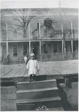 A child is pictured at the top of the steps. Subject unidentified. 