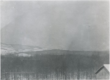 Scene overlooking the snow-covered hills.