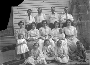3rd from left: Thomas Jefferson Taylor (great grandfather of James Green); 1st from left, back row: Oscar Goodluck; just below Oscar: his wife, Julia Taylor Goodluck; 1st from left, front row: James E. Green (photographer's son); 2nd from left, front row: Virginia Green; 4th from left, front row: daughter of Walter Taylor; 4th from left, back row: Walter Taylor.