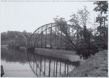 Photo showing the bridge over Cheat Lake. The bridge was built in 1922 by the Independent Bridge Company of Pittsburgh. It spans across the lake along County Route 857.