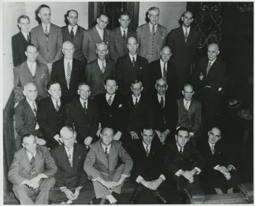 Pictured from left to right in the back row is Henry Harrison, Mr. Ketchum, unidentified, Jack Mann, B. Thompson, Mr. Minichian, and Bill Miller.In the third row, from left to right, is Mr. Vass, unidentified, Mr. Garten, Earnest Allen, S. O. Gum, and Jon Taylor.In the second row, from left to right, is Emmitt Mann, Lee Barnett, E. C. Eagle, unidentified, Harry Humphries, Walter Jackson, and Bernard Gerch.In the first row, from left to right, is Bert Hout, Guy Belcher, Fred Maddy, unidentified, Lynn Miller, and unidentified. 
