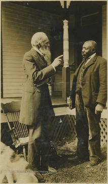 Ballengee, pictured with the beard on the left, speaks with an African-American man.