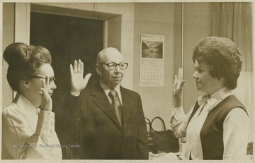 From left to right, Barbara Carr, County Clerk; Marvin Lacy, Summers County Commissioner; and unidentified. 
