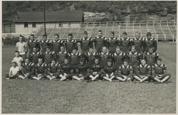 Players pose in their uniforms for their team photo. Subjects unidentified. 