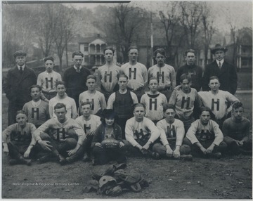 Mary Dolin holding football in the front.Front row, left to right: Voile Turner; Harold McNeer; Ashly Eubanks; "Ram" Harford; Jim Anderson; Warren Holbert; and Sam Bess.Middle row, left to right: Ford Wauhop; Milton Bean; John Faulconer; Herman Fredeking; Jack Hayes; Alton Riddlebarger; and Hobart Foster.Back row, left to right: J. S. "Cowboy" Duncan; Coach (and Principal) Theodore Martufi; Norman Wilson; Buster Coleman; Bob Harford; Coleman Hank; Carthon Haythe; and Frank Tomkies (superintendent). 