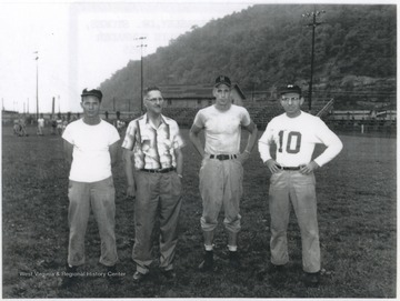 From left to right, Harold Beasley, Dr. Stokes, Bill Garten, and Charlie Schrader pictured on the field. 