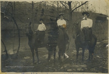 Three women pictured on horses. Subjects unidentified. 