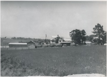 View of the farm house and grounds from across a field beyond the Keatley property.