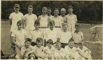 Back row, left to right: Irish Garrity, Punchy Neely, three unidentified campers, and John Herbert Swatts. Bobby Neely pictured far left in the second row. Bill Neely pictured far right in first row.The camp later became "Camp Summers" in 1985.