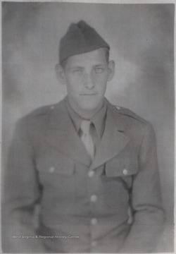 Cook, a World War II soldier, is pictured in uniform. 