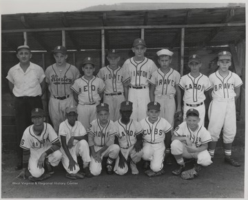 Pictured next to Eddy Cobb, team manager and coach, is Richard Rodes, Danny Smith, an unidentified boy and Tom Faulkner. The rest are also unidentified. This was the all-star team. 