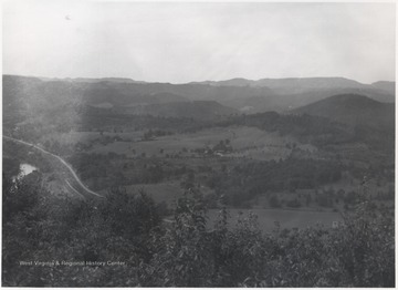 Rolling hills seen in the distance. Greenbrier River slightly pictured on the left. 