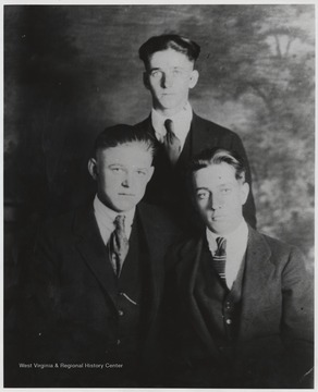 Foy and Luther Meador, left and center, are pictured with friend Johnny Cooper, right. The boys are photographed near True, W. Va.