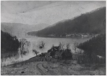 At the far side of the photo is John Barker's farm in the background. Near the side of the river is Hoke Neely farm at Surveyor Branch. 