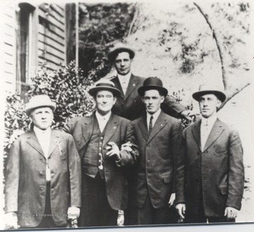 Pictured from left to right is engineer John Scott, conductor J. C. Morgan, fireman J. B. "Bert" Hatcher, engineer E. T. Lawson, Sr., and standing in the back is engineer G. R. Sale.