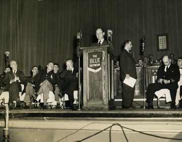 Photo taken during the Army-Navy Award presentation inside of the Capitol Theatre in Wheeling, West Virginia. The presentation was broadcast on over 127 radio stations of NBC's Blue Network, including the "It's Wheeling Steel" radio program. The "It's Wheeling Steel" radio broadcast was moved to the Capitol Theatre in Wheeling, West Virginia in 1939 as production became more polished and more and more listeners tuned in.