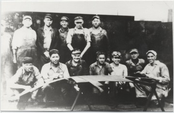 Front row, from left to right, is unknown, John Plumley, D. J. Via, E. B. Moten, W. M. Harvey, unknown, and Mr. Stewart.Second row, from left to right is Ed Adkins, B. P. Roye, unknown, unknown, Whitey Stoddard, and Joe Allen.