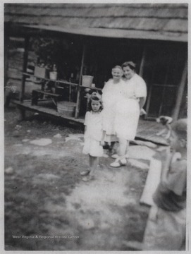 Virgie Cook Lilly and Etha Freeland Lilly pose beside a young Juanita Lilly.