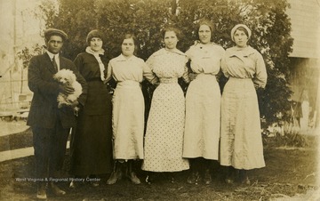 Caption on back of photo reads: "2 from left Pearl Parkes, 5 Sylvia McCoy, Jades wife."