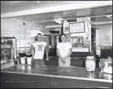 Emmitt Fox, Jr. and co-worker pictured behind the counter. 
