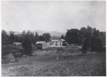 An unidentified woman and her children enjoy the fields beside the boarding house.