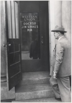 Stokes pictured walking into the Laing Humphries building entrance where Citizens Bank used to be located. 