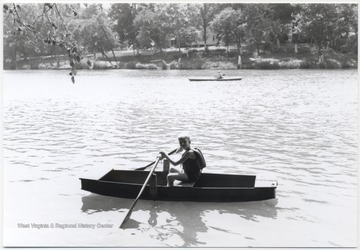 Miller Murrell sits in a small rowboat. 