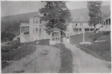 An unidentified woman walks along the pathway on the hotel grounds.