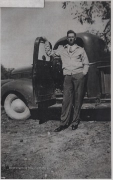 Mark poses beside his truck. The farm is located near War Ridge.