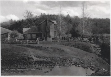 View from across the pond of the farmhouse and grounds near War Ridge.