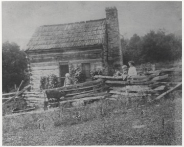 Sarah Amanda Skaggs Taylor pictured with Madge Nichols Skagss and her children outside of Meadows Cabin. Currently, Dr. Richards owns the property.