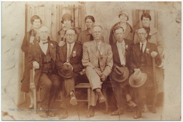 In the front row, from left to right, is Will Mann; George Keaton; Walter Mann; Charlie Mann; Allen Cooper.In the back row, from left to right, is Julia Mann; Oda Keaton; Lydia Mann; Minnie Man; Eliza Cooper. 