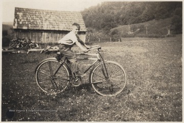 A relative of J. D. Morris is pictured on a bike. 