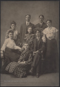 The unidentified family members gather for a family portrait.