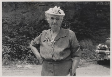 Neely pictured in a dress and hat, perhaps coming from church service. 