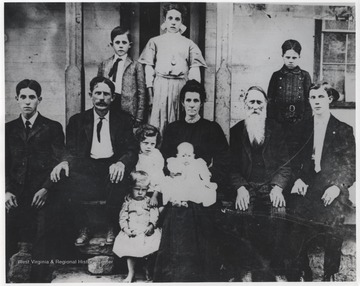 Pictured from left to right  is Claude Neely; Levi M. Neely, Jr. (father of Arville); Izetta Alice Hogan Neely (mother, b. 1865); Levi Neely (b. 1862);  Live M. Neely, Sr.; Arville Neely (child with curly hair); Oliver O. Neely (child standing); baby Levi H. Neely; Frank M. Neely (boy); Cassie L. Neely; and Cecil R. Neely (boy).