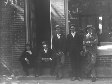 Five unidentified boys standing in front of an unknown store in Morgantown, W. Va.