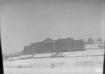 View of the Women's Hall in the snow showing a "Beat Pitt" sign.