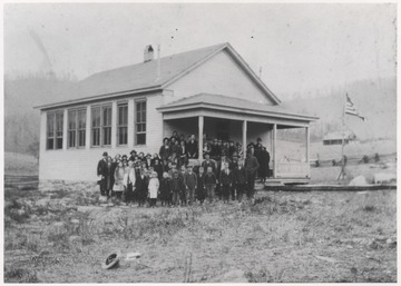 A group of students and faculty are pictured outside of the school building located in Summers County.