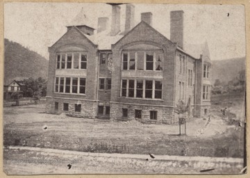 Photograph looking at the old Hinton High School building from across the street. 