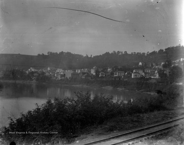 View from the sharp bend in the river, along the railroad tracks, looking back on Seneca before the glass works were moved there