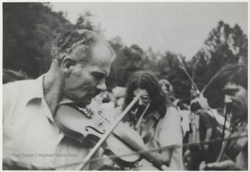This photograph comes from a series of photos from Appalachian Folk Music Festivals, including the Ivydale and John Henry festivals. 