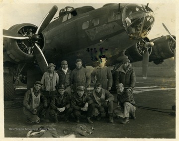 Crew members, including Kingsley Spitzer of Hardy County, W. Va., pose in front of the Eighth Air Force B-17 Flying Fortress "Situation Normal" during World War II.Front Row (Left to Right): Navigator (Lieutenant Harry Meuntz), Bombardier (Lieutenant Richard Holmes), Co. Pilot (Lieutenant William Overstreet), Pilot (First Lieutenant Alden R. Witt), Engineer (Technical Sergeant Kingsley Spitzer).Back Row: Ball Gunner (Wendall Vergulucz), Tail Gunner (Sandy Sanchez), Radio Gunner (Technical Sergeant Roy Baughman), Right Waist 6 (Sergeant Charles Schaback), Left Waist 6 (Sergeant Everell Lewis).
