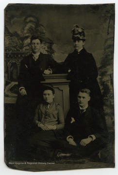 Portrait of James Barrick, Sadie West, Nancy Lauck. and Nat Reynolds from a photograph album of late nineteenth century images featuring residents of Keyser, W. Va.