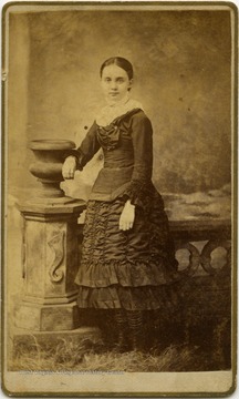 Portrait of Mammie Woodcock from a photograph album of late nineteenth century images featuring residents from Keyser, W. Va.