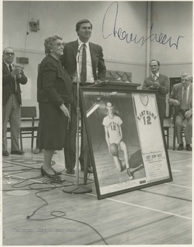 West poses with his fourth grade teacher, Wilhelmina Johnson, during the ceremony to rename the high school's gym the "Jerry West Gymnasium."