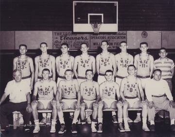 In the front row, left to right, are Coach Tony Gentile (Williamson), Butch Goode (Pineville), George Ritchey (Chattaroy), Jay Jacobs (Morgantown), Mickey Neal (Williamson), Ed Christie (Clarksburg-Washington Irving), Coach Tony Folio (Clarksburg-Washington Irving).  In the back row, left to right, are Jim Warren (Clarksburg-Washington Irving), Jerry West (East Bank), Howard Hurt (Beckley), Jim McDonald (Bridgeport), Carl Johnson (Williamson), Willie Akers (Mullens), Larry Brothers (Parkersburg), and an unidentified manager.