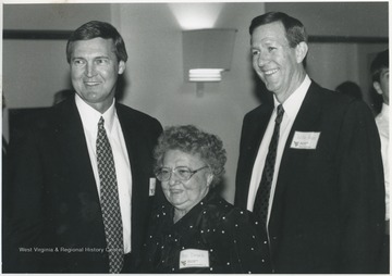 West, left, and Akers, right, pose with Ann Dinardi. West had lived in Ann and her sister Erlinda's Beechurst Avenue home during his college basketball days at West Virginia University.