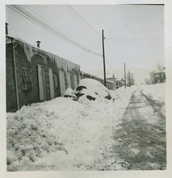 The Star City Glass Factory covered in snow after a large snow storm during the winter of 1950.