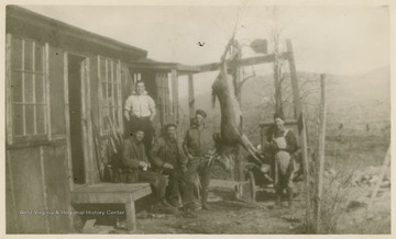 This image is part of the Thompson Family of Canaan Valley Collection. The Thompson family played a large role in the timber industry of Tucker Country during the 1800s, and later prospered in the region as farmers, business owners, and prominent members of the Canaan Valley community.Men pose for a picture at what is possibly Burley's lumber camp.